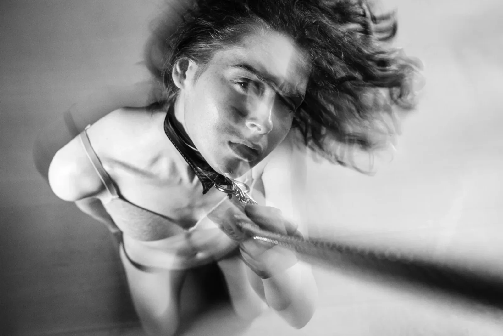 Motion blurred black and white carpet photography of COMPELLED - ROBIN by Arjan Spannenburg.